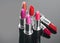 Lipstick. Professional makeup and beauty. Lipstick tints palette closeup. Colorful lipsticks over black