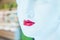 Lipstick symbol, woman mannequin with bright red lipstick