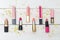 Lipsticks for lip and lip gloss with golden sparkles on a wooden