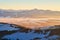 Liptov countryside and Low Tatras from Janosikov stol rock during winter sunset