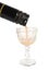 Liqueur falling in glasses on the white background