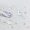 Liquid gel or serum pipette with drops on gray background