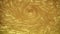Liquid gold abstract background. Golden sand in the water. Yellow texture
