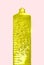 Liquid golden collagen serum in the tube with bubbles on pink pastel background