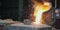 Liquid iron molten metal pouring in container, industrial