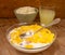 Liquid milk whey in a glass and cottage cheese in bowl on rustic wooden background. Dairy production Breakfast