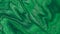 Liquid paint background shimmering green glitter