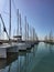 Liquid path between moored yachts with masts at Alimos Marina, Athens, Greece