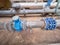 Liquid pipes with a valve in the exchange room. Knive and ball valves and pipelines