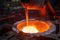 Liquid steel is poured from a metallurgical ladle. Generative AI