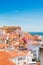 Lisbon city with red tile roofs and monastery Igreja Sao Vicente de Fora, Portugal