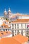 Lisbon city with red tile roofs and monastery Igreja Sao Vicente de Fora, Portugal