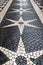 Lisbon cobblestone pavement in black white star and diamond designs