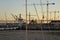 Lisbon harbour, Portugal. Cranes at sunset