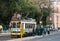 Lisbon, June 18, 2018: Locals try to get into the crowded old-fashioned yellow tram at the tram stop. The usual everyday