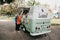 Lisbon, June 18, 2018: People buy frozen yogurt or ice cream from a street vendor. Street food and mobile commerce