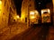 Lisbon night scene of narrow alley with steep stone stairs and illuminated funicular