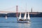 Lisbon, Portugal - 12/28/18: Sailboats on the Tagus River, 25 April Bridge background