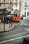 LISBON, PORTUGAL - January 01, 2018: Touristic vintage red tram in a Lisbon on the station, narrow streets, cobblestones