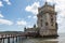 Lisbon, Portugal - May 12, 2018: Historic Torre de Belem tower at Tejo River banks in Lisbon, Portugal
