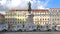 LISBON, PORTUGAL - NOVEMBER 2, 2017: An alignment of Tuk Tuk at Figueira Square in Baixa neighborhood with the statue of Dom Joao