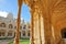 LISBON, PORTUGAL - NOVEMBER 3, 2017: The cloister of Jeronimos monastery in Belem neighborhood with details of the carvings, the c