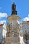 LISBON, PORTUGAL - NOVEMBER 4, 2017: Close-up on Luis de Camoes poet statue at Camoes Square in Bairro Alto neighborhood with two