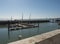 Lisbon, Portugal, October 24, 2021: View of Doca da marinha, small marina with boats and restaurants at waterfront in