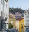 Lisbon, Portugal, October 24, 2021: View of Lisbon street and Castelo de Sao Jorge at medieval quarter Alfama, Lisbon