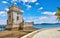 Lisbon, Portugal. Tower Belem at coast. Embankment alley with palm tree.