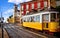 Lisbon Portugal. Yellow vintage tram driving