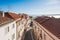 Lisbon roofs and street aerial view against blue sky