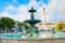 Lisbon Rossio square fountain people