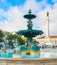 Lisbon Rossio square fountain people