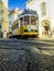 Lisbon`s legendary yellow tram. Streets of the Portuguese capital.