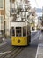 Lisbon street scene with yellow tram