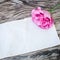 Lisianthus bouquet on a wooden table with blank note