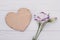 Lisianthus eustoma flower and wooden heart.