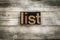 List Letterpress Word on Wooden Background