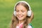 Listen music while walking. Girl headphones listening music. Educational podcast. Kid girl enjoy music. Pleasant time