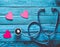 Listen to your heart. Checking the heart for diseases. The concept of care for the heart. Stethoscope, hearts on a blue wooden