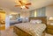 Lit bedroom of luxury California home with a pillow display and