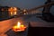 Lit Candle on a Boat at Night in The Ganges River in Varanasi, India