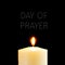 Lit candle and text day of prayer