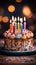 Lit candles adorn a colorful birthday cake on a wooden table