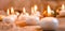 Lit candles, Christmas tree Golden baubles and burlap on a wooden background. New year`s and Christmas concept