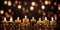 Lit candles on a table arranged in rows for an appealing display.