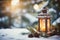 Lit Christmas lantern under the Christmas tree in the snow, covered with snow at night outdoors. Christmas mood. Selective focus.