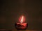 Lit diya lamp. Clay diya. Traditional Diwali festival.