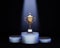 Lit a glowing Golden Cup on a pedestal. Award winning and championship cup. 3d rendering